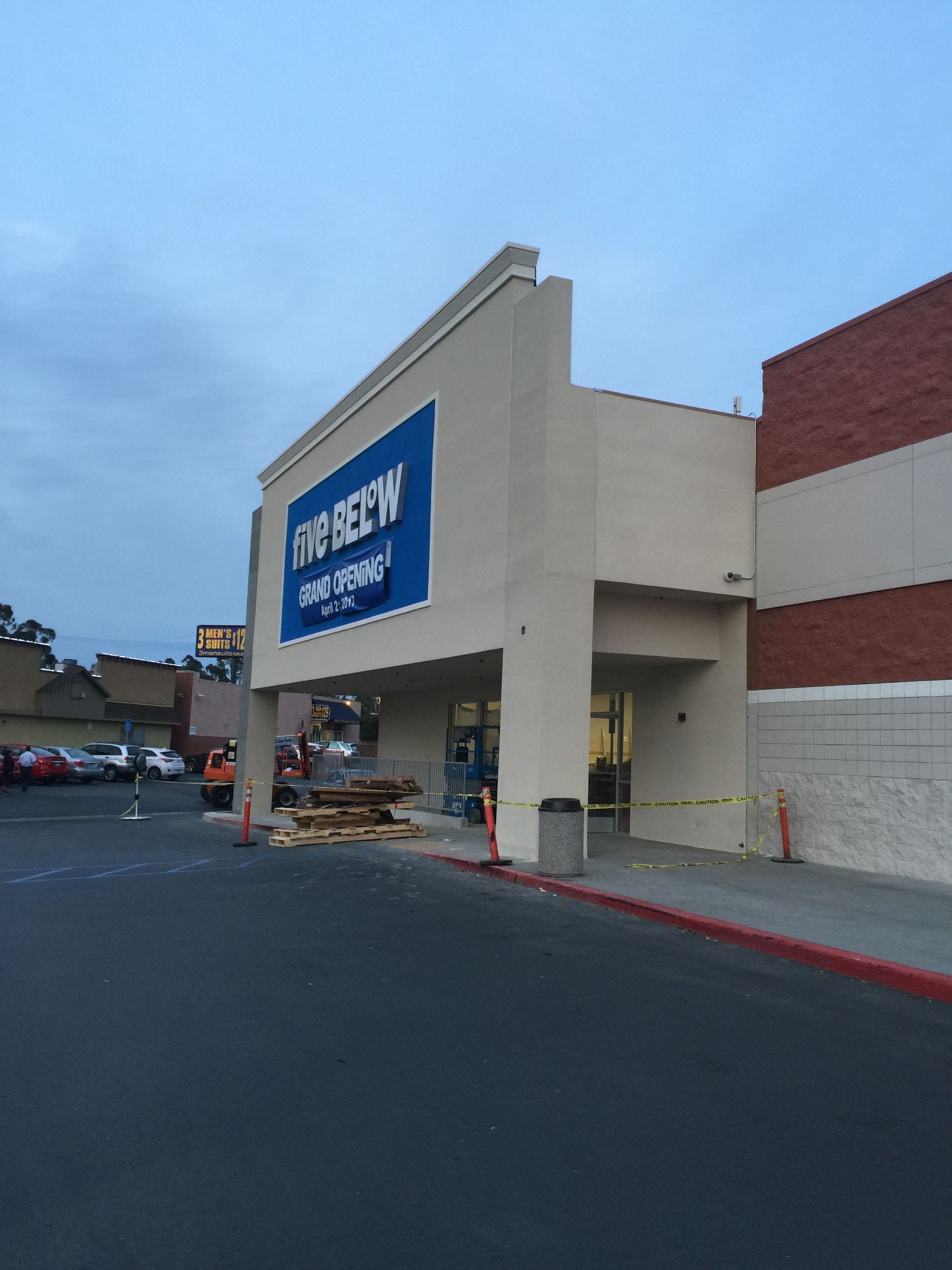 Exterior of a Five Below store with blue signage and construction in progress.