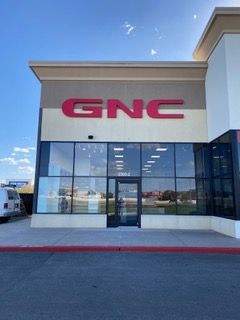 GNC store front with large red 