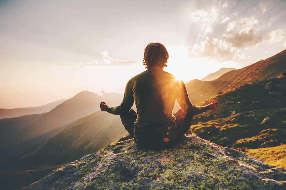 Man Meditating Yoga at Mountain — Worldwide — Zen4Life Coaching & Consulting