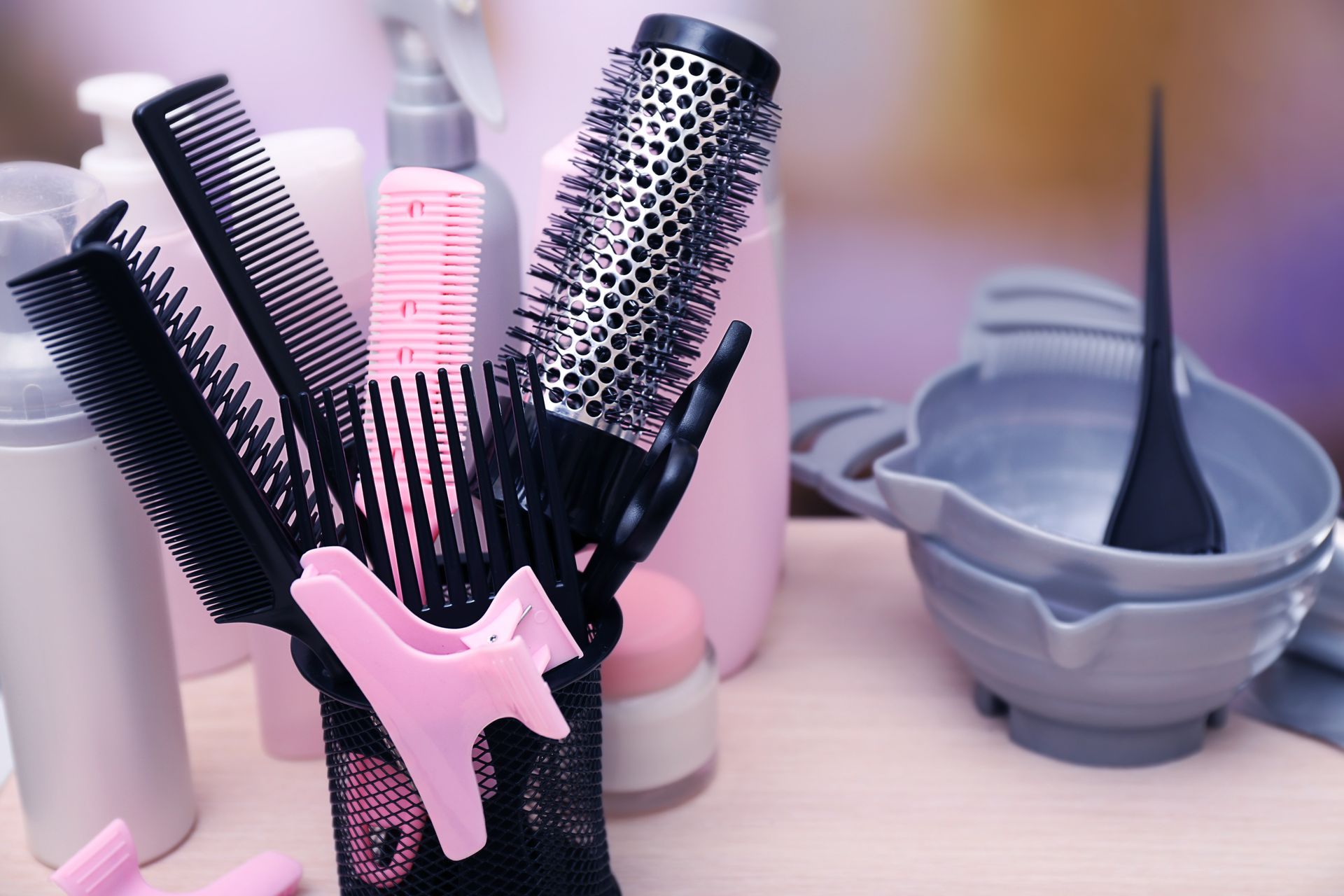 A photo of plastic hair brushes and beauty tools