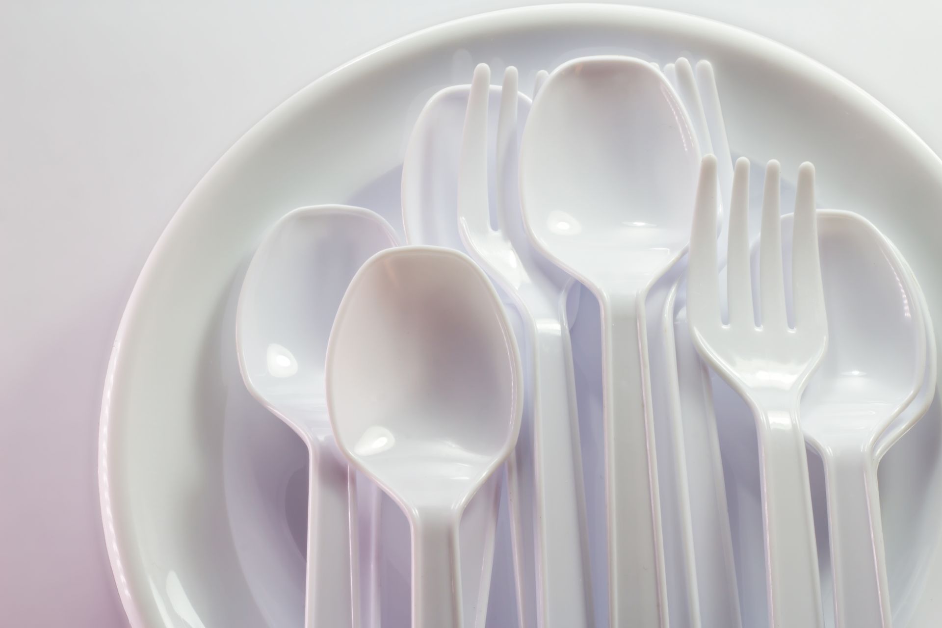 A photo of plastic forks and plates