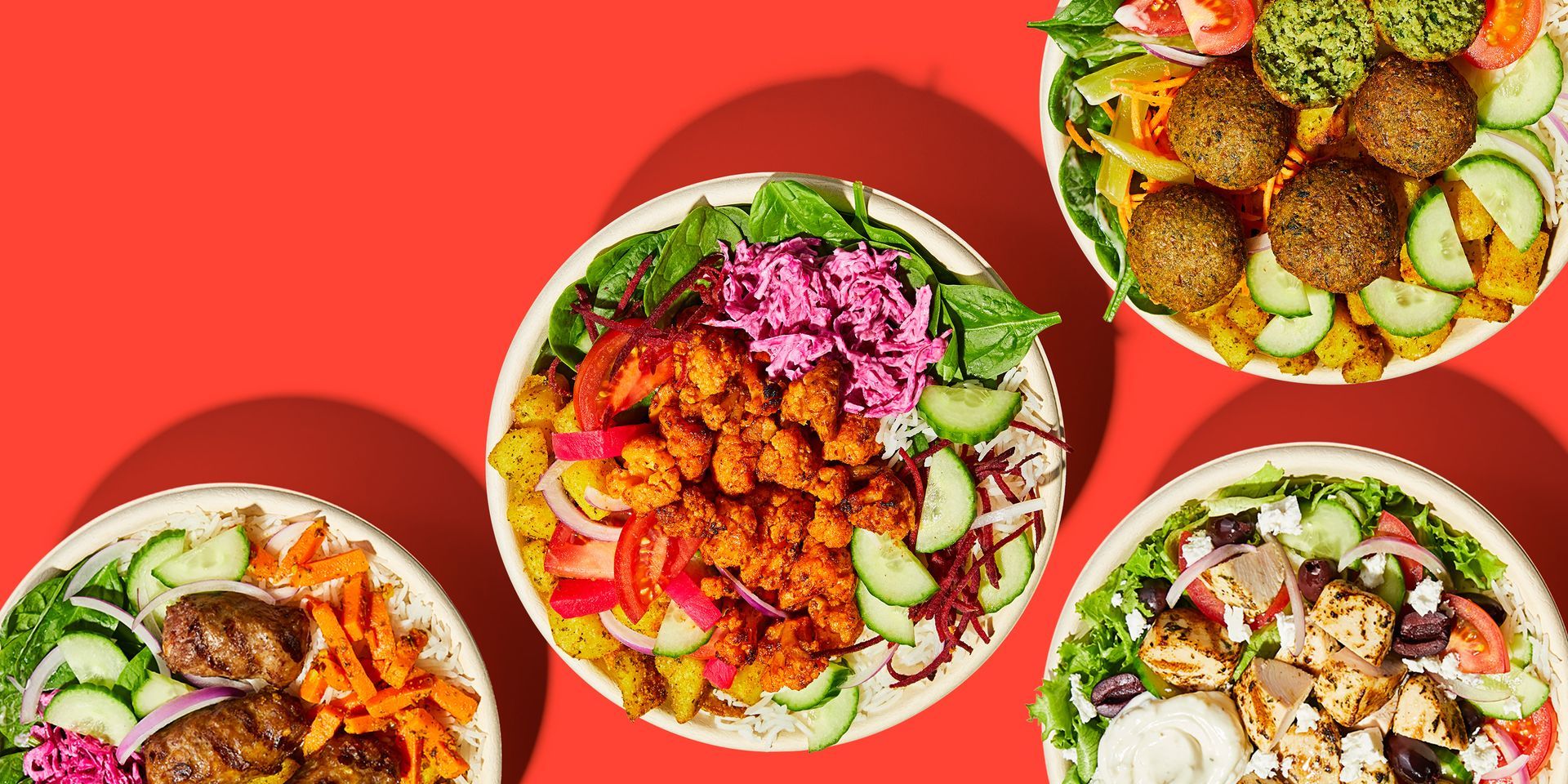 Three bowls of food are sitting on top of each other on a red table.