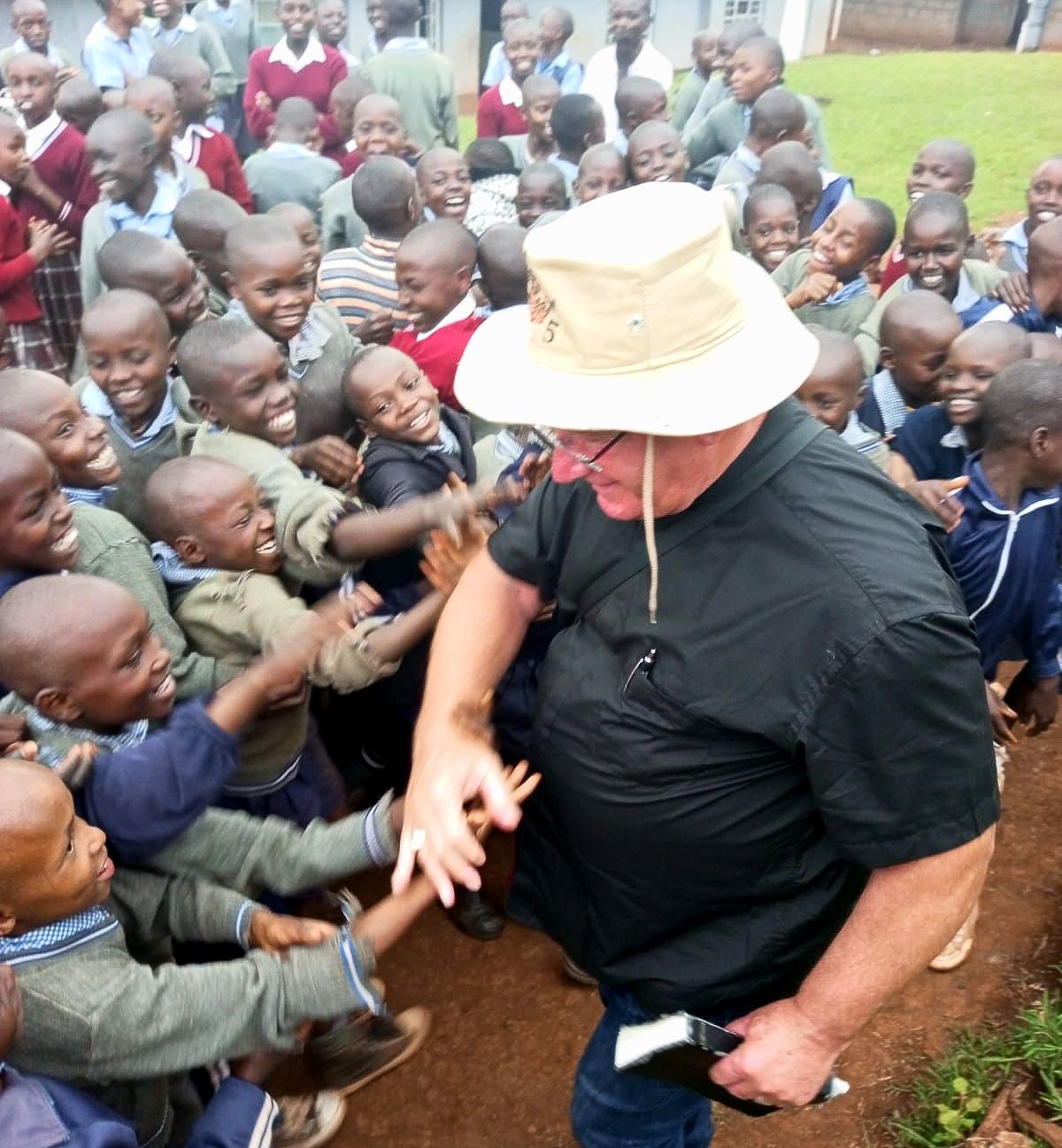 Rev. Michael Brandsma with school children in Kapsabet, Kenya