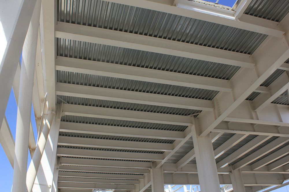 Ceiling of a Building Under Construction With a Blue Sky in the Background — Mayric Engineering in Taree, NSW