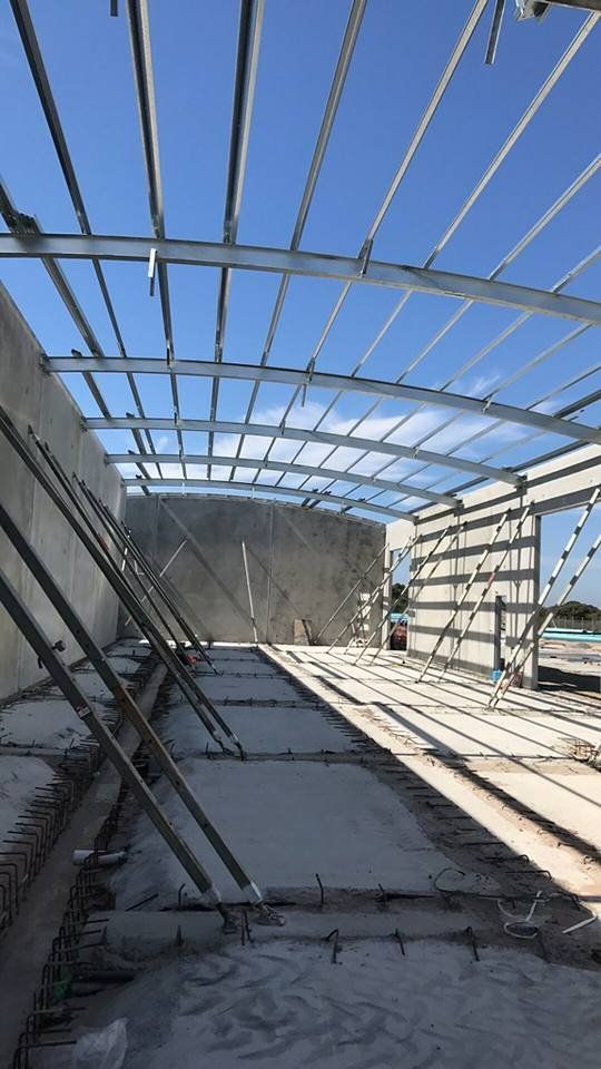 The Inside of A Building Under Construction with A Blue Sky in The Background — Mayric Engineering in Hallidays Point, NSW