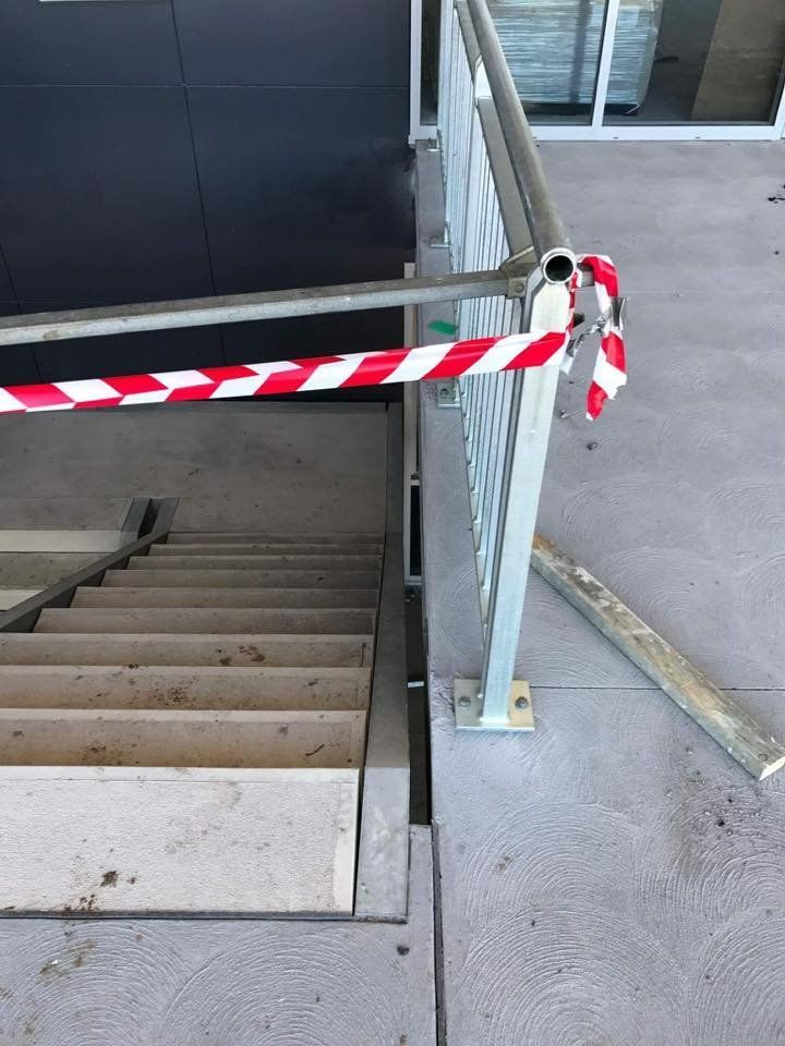 A Staircase with A Red and White Striped Tape Around It — Mayric Engineering in Old Bar, NSW