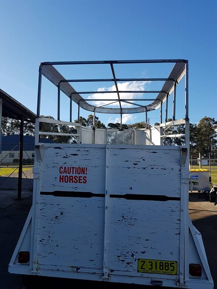 A White Trailer with A Sign that Says Caution Horses — Mayric Engineering in Hallidays Point, NSW