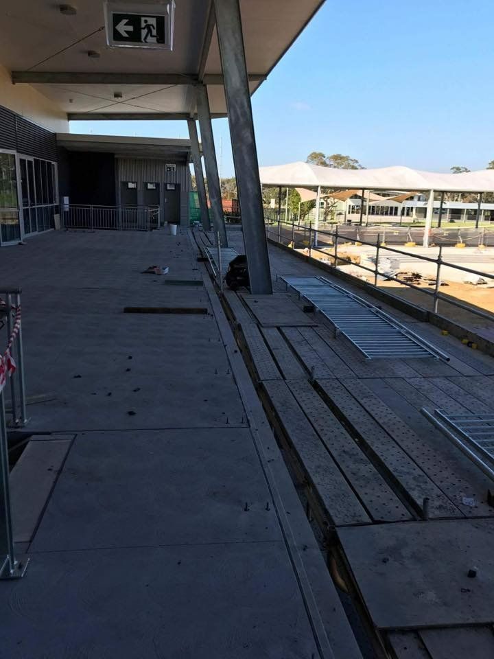 A Building with A Sign that Says Exit on It — Mayric Engineering in Taree, NSW