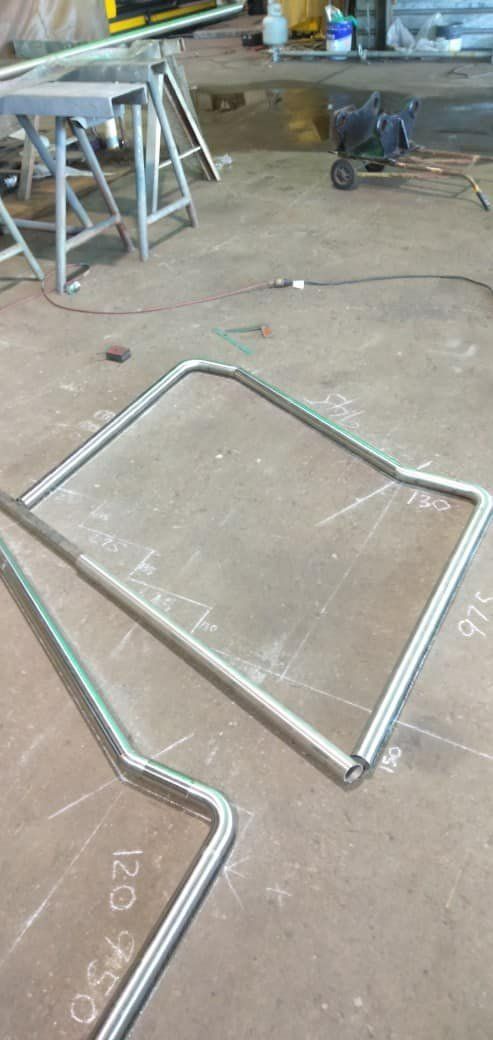 A Metal Frame Is Sitting on The Floor in A Factory — Mayric Engineering in Hallidays Point, NSW