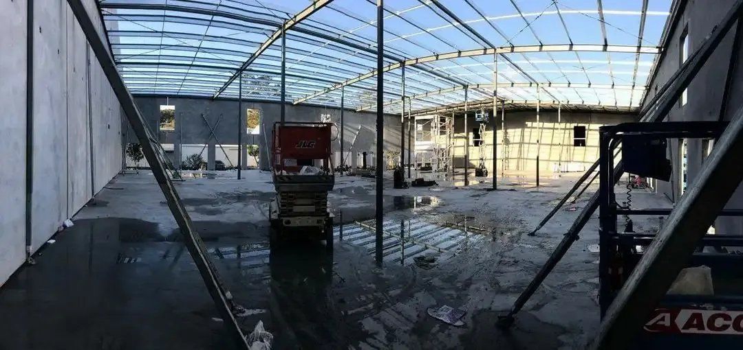 A Large Empty Building with A Scaffolding in The Middle of It — Mayric Engineering in Wingham, NSW