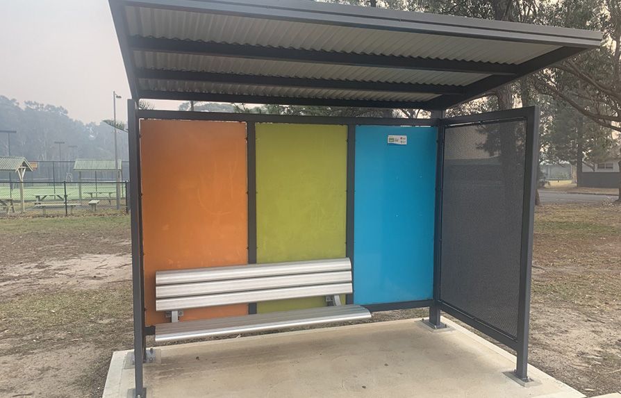 Bus Stop With Colourful Walls and a Bench — Mayric Engineering in Taree, NSW
