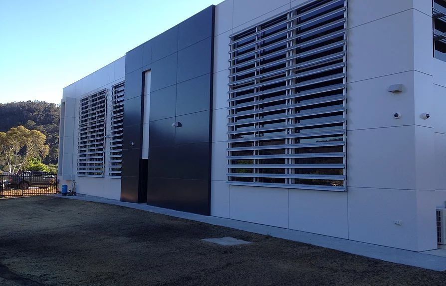Black and White Building With a Lot of Windows — Mayric Engineering in Taree, NSW
