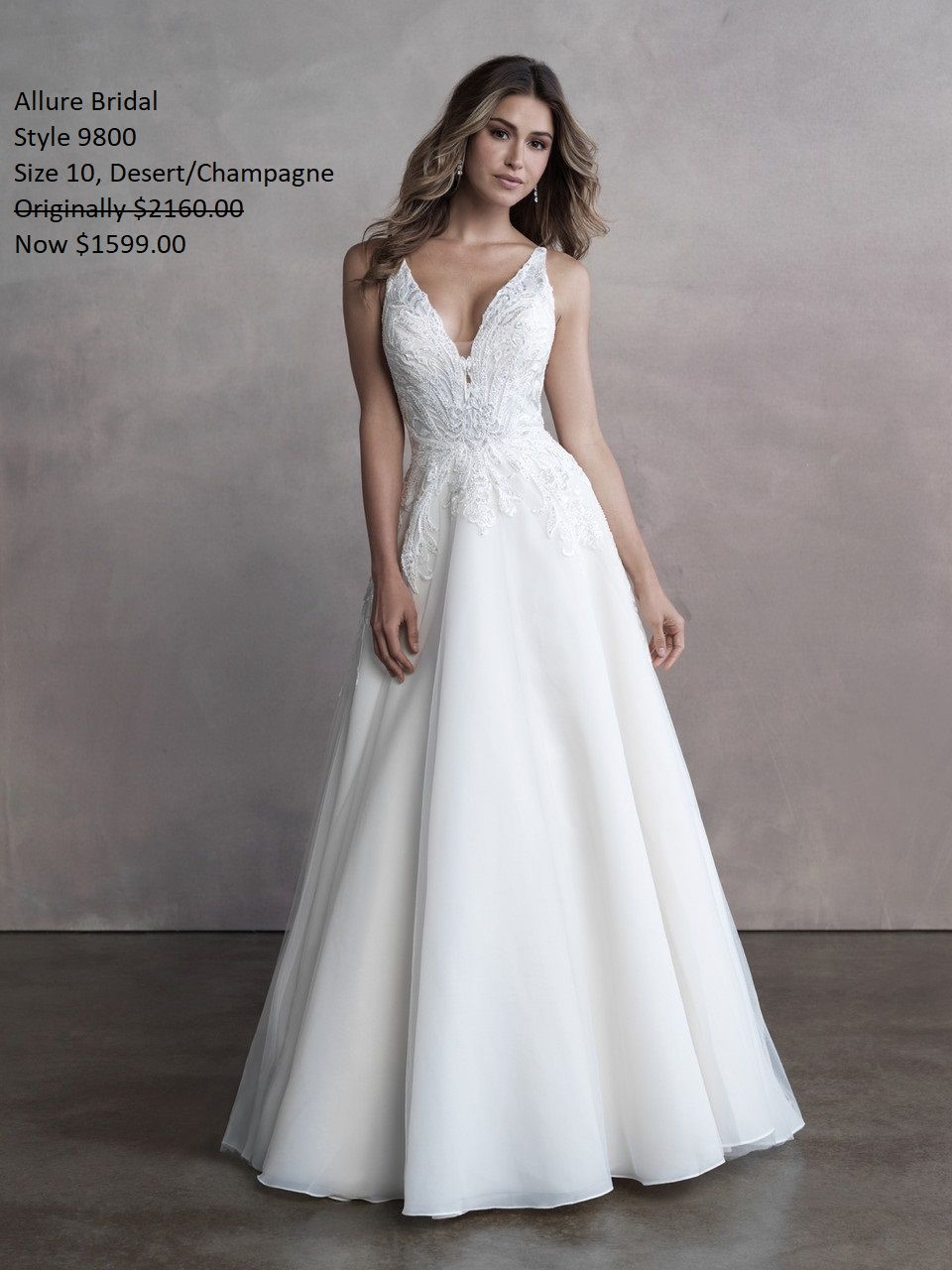 A woman is wearing a white wedding dress with a plunging neckline. Allure Bridal 9800