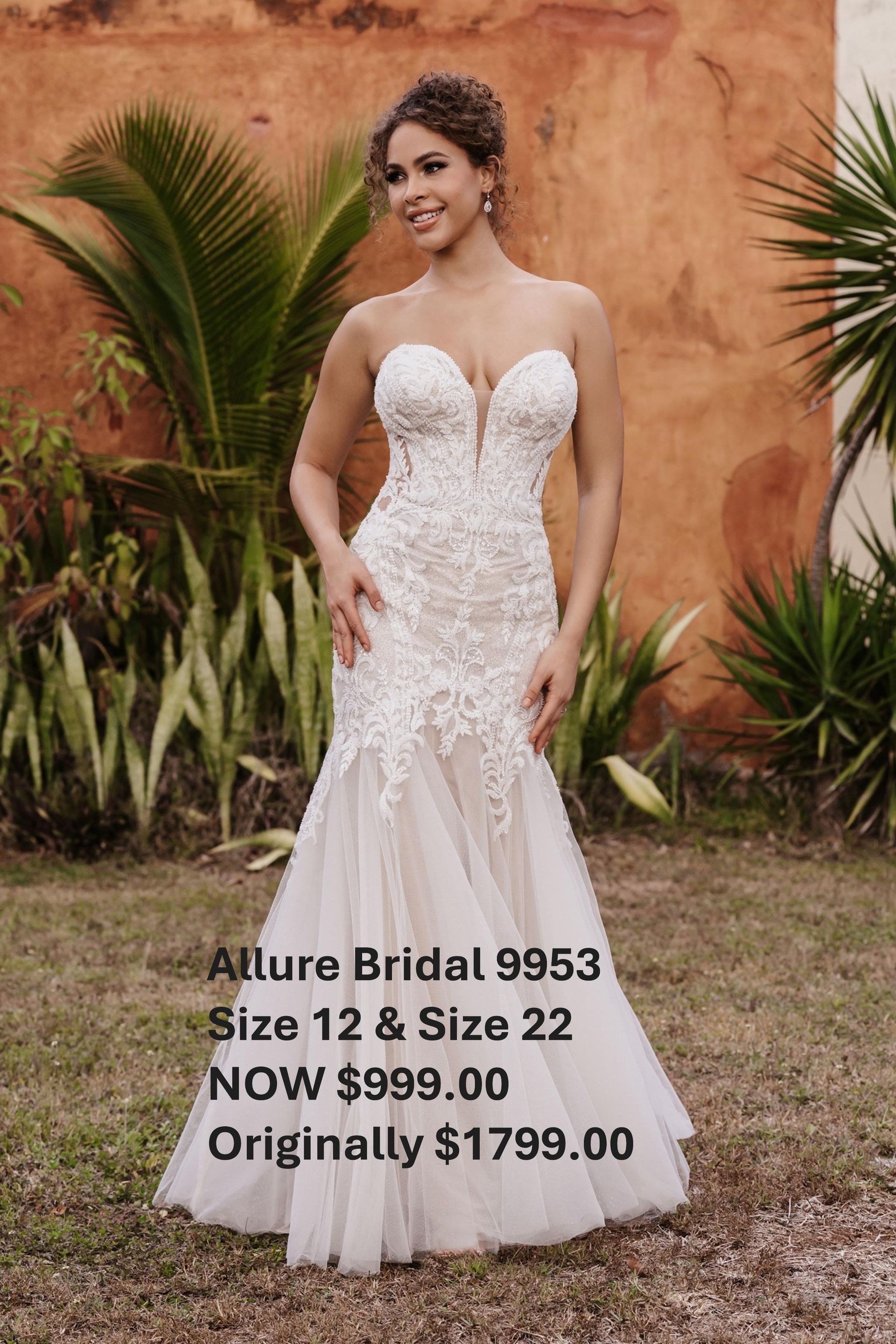 A woman in a white wedding dress is standing in a field. Allure Bridal 9953