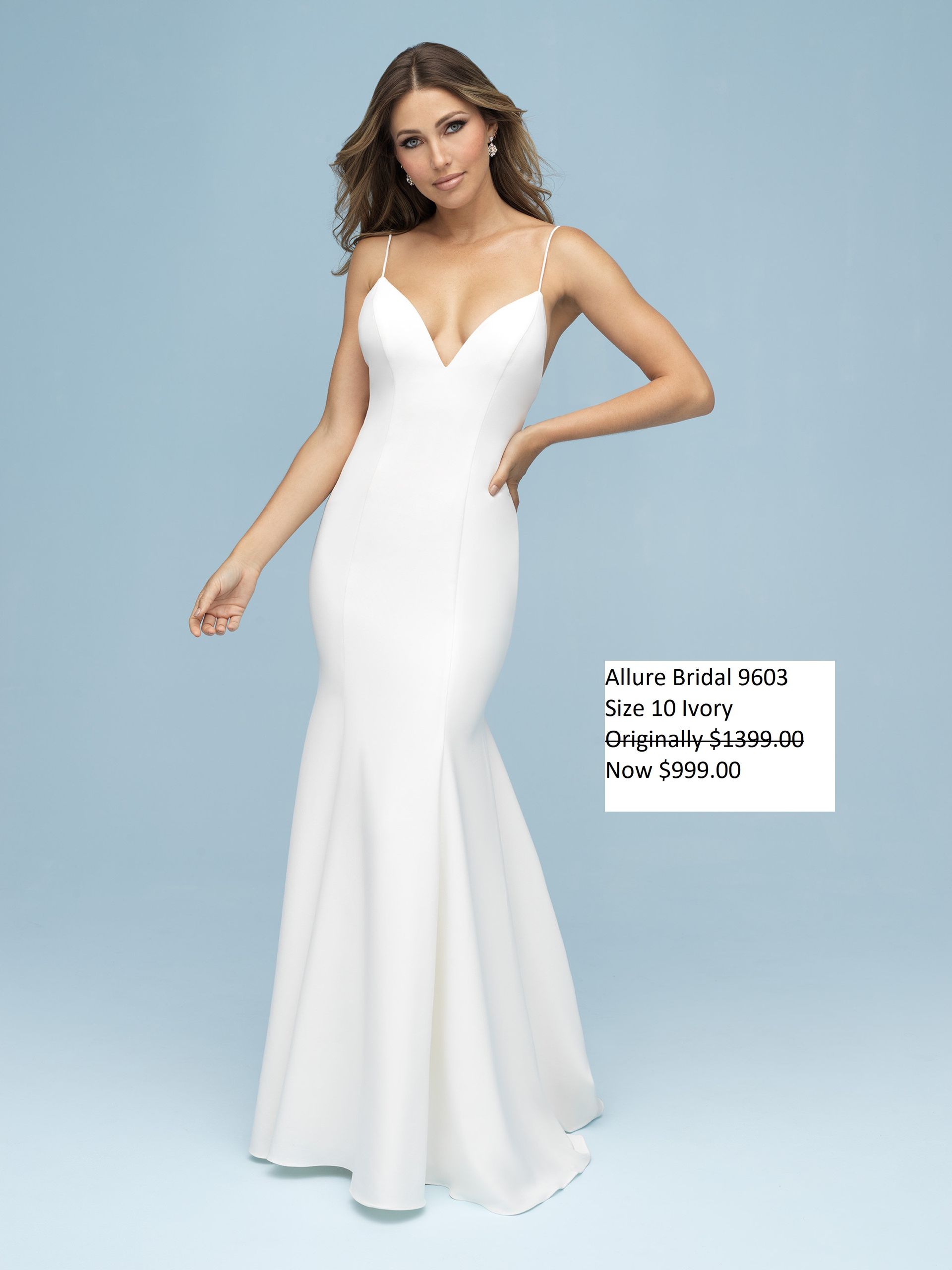 A woman is wearing a white dress with spaghetti straps. Allure Bridal 9603