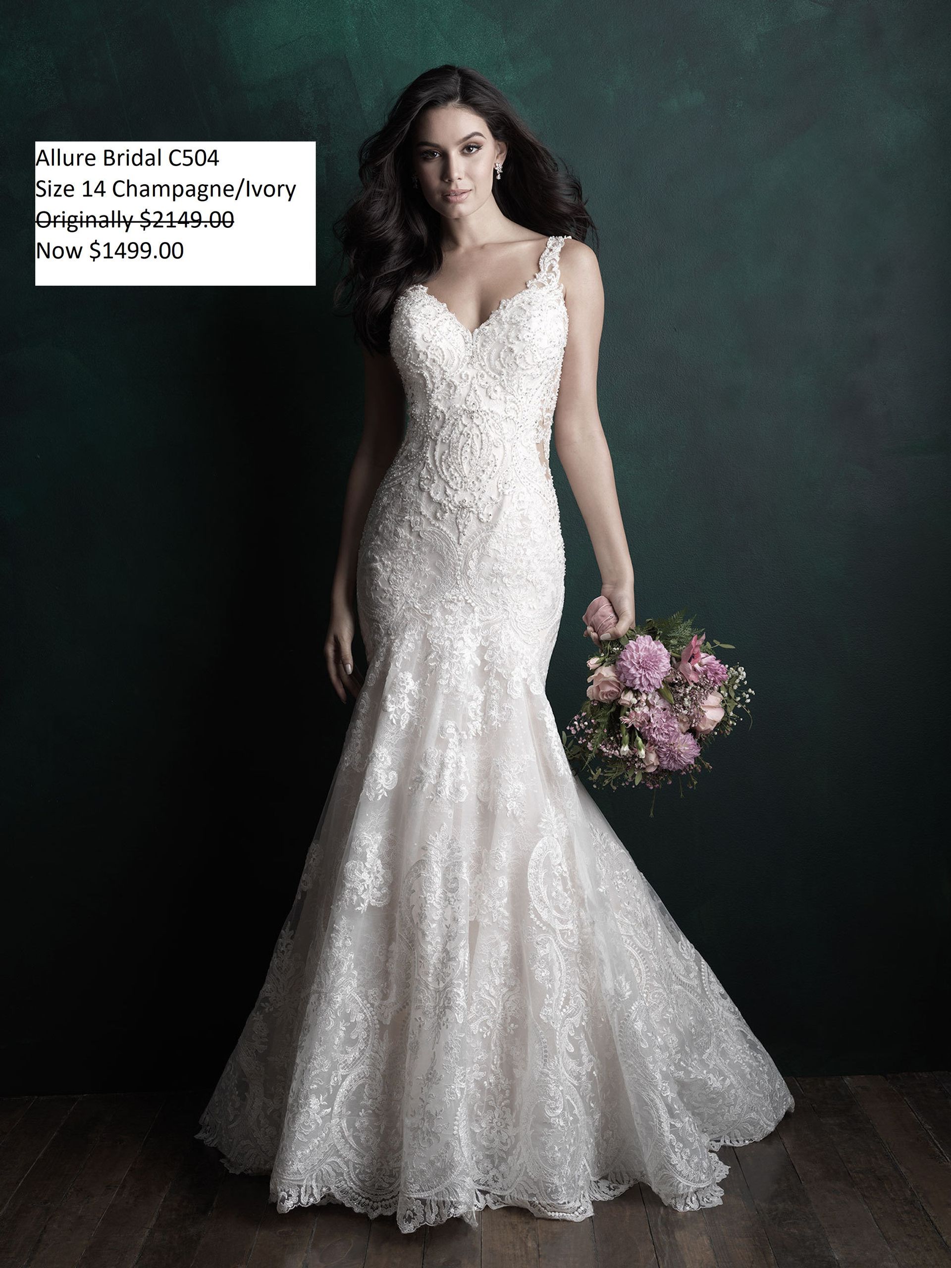A woman in a wedding dress is holding a bouquet of flowers. Allure Bridal C504