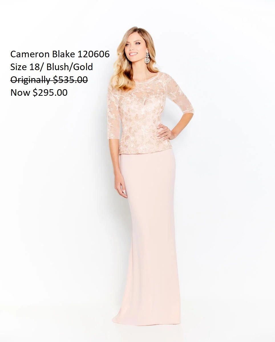 A woman is wearing a long pink dress with a lace top.