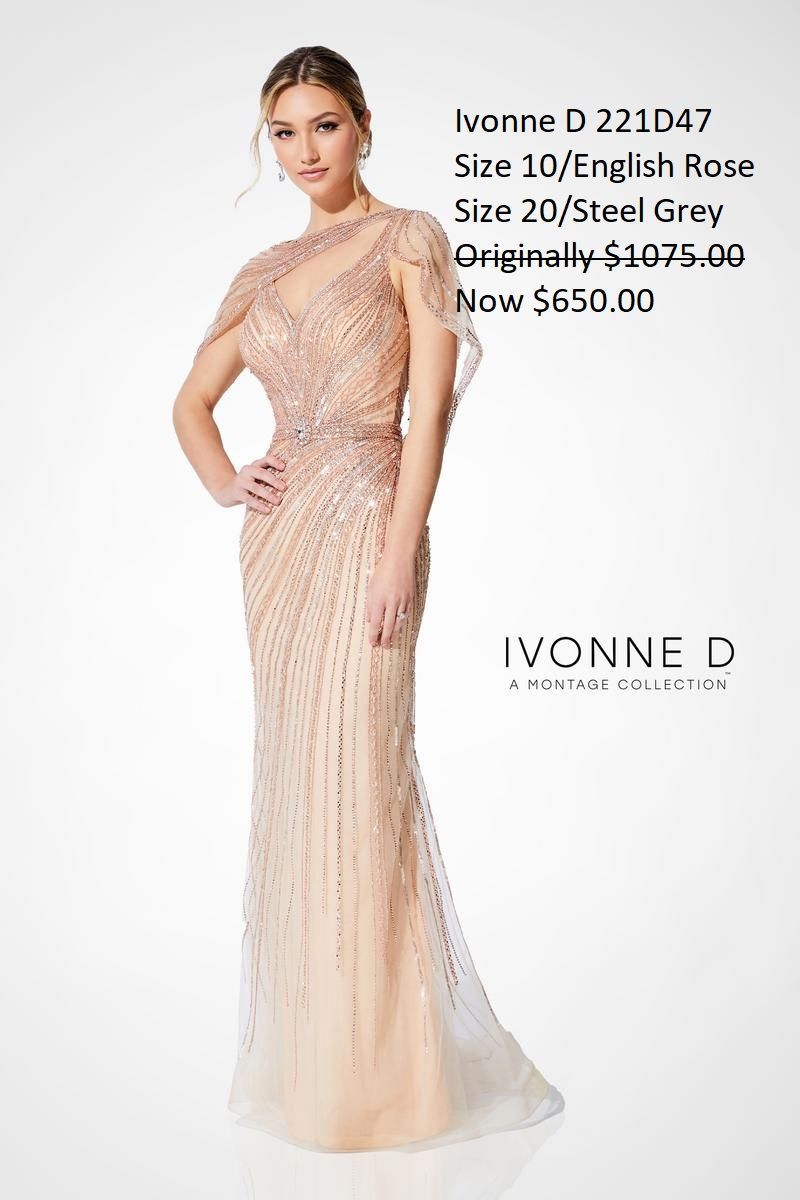 A woman is wearing a long dress with a cape.