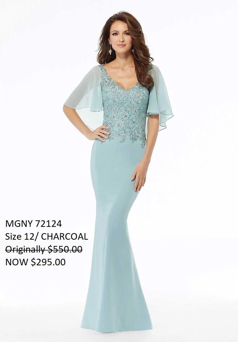 A woman is wearing a light blue mother of the bride dress.