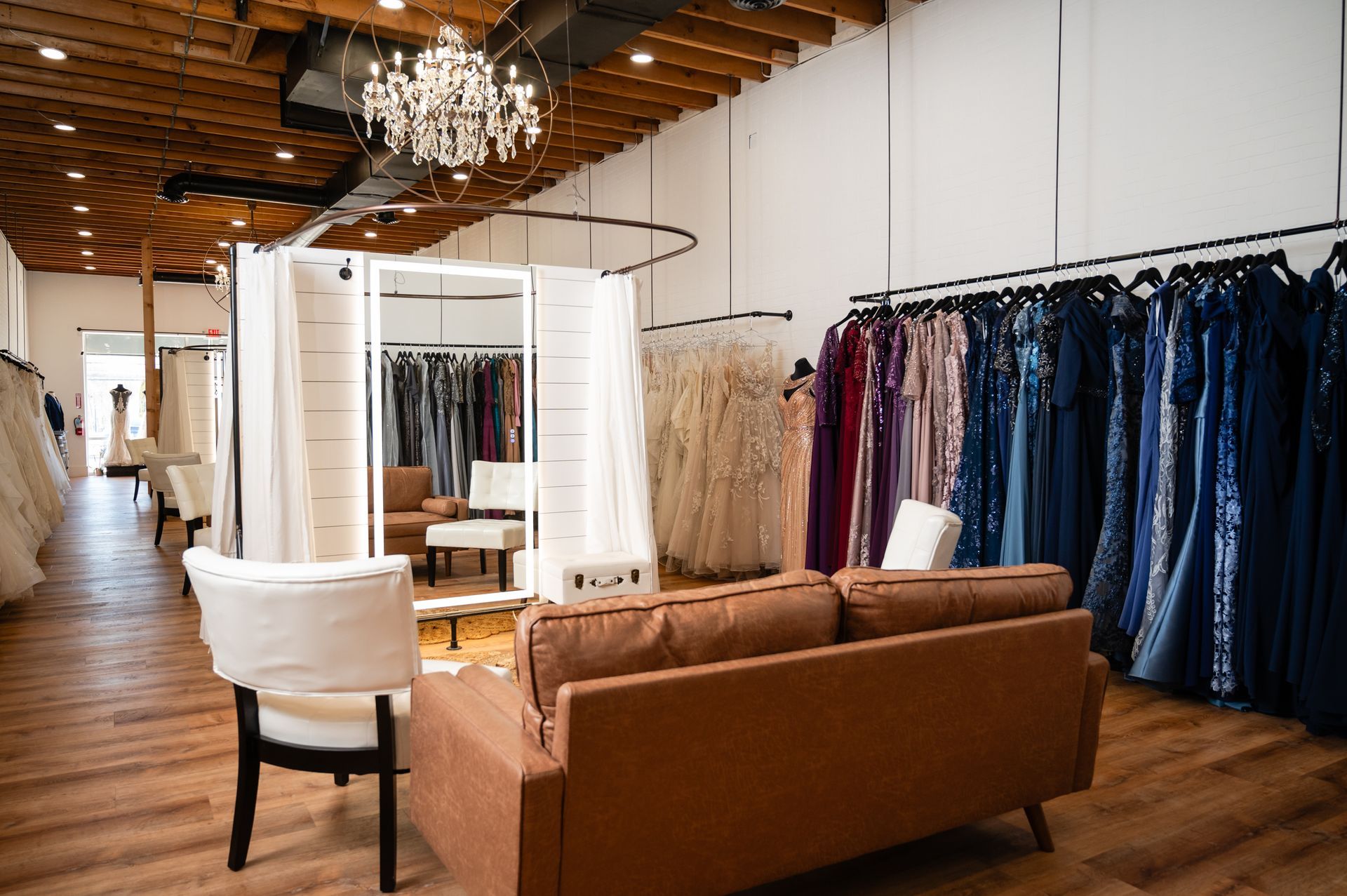 There is a couch and chair in the middle of the room.