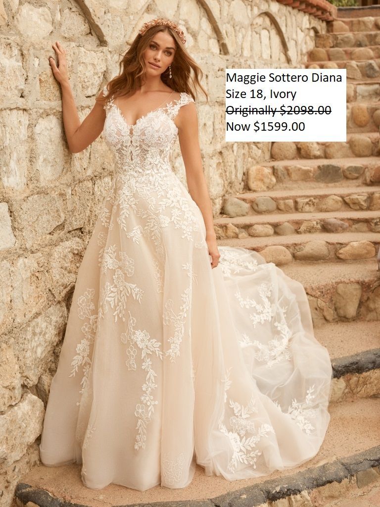 A woman in a wedding dress is standing next to a stone wall.