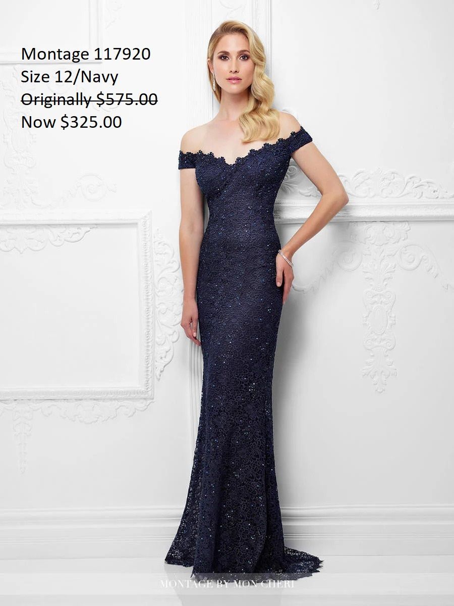 A woman is wearing a blue lace off the shoulder dress.