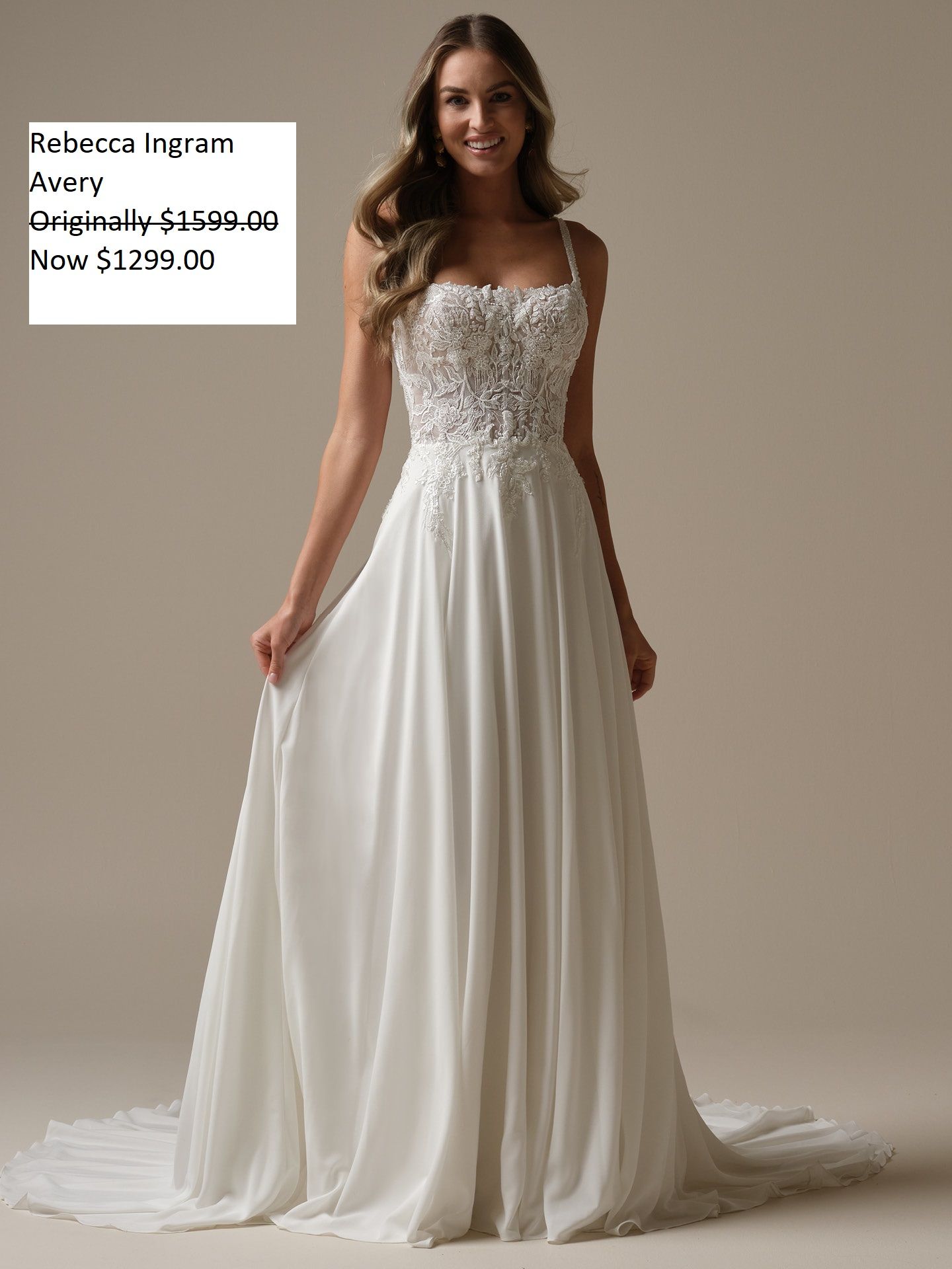 Woman in a white wedding dress with beaded bodice, flowing skirt, and holding the hem. Rebecca Ingram Avery