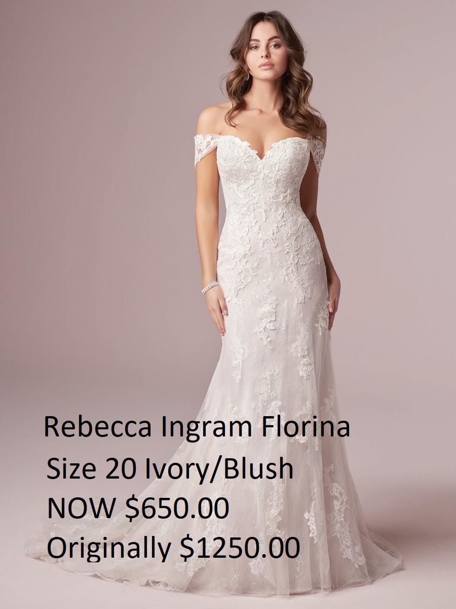 A woman is wearing a rebecca ingram florina wedding dress