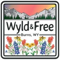 Square logo: Mountains, sunset, wildflowers, text "Wyld & Free" and "Burns, WY".