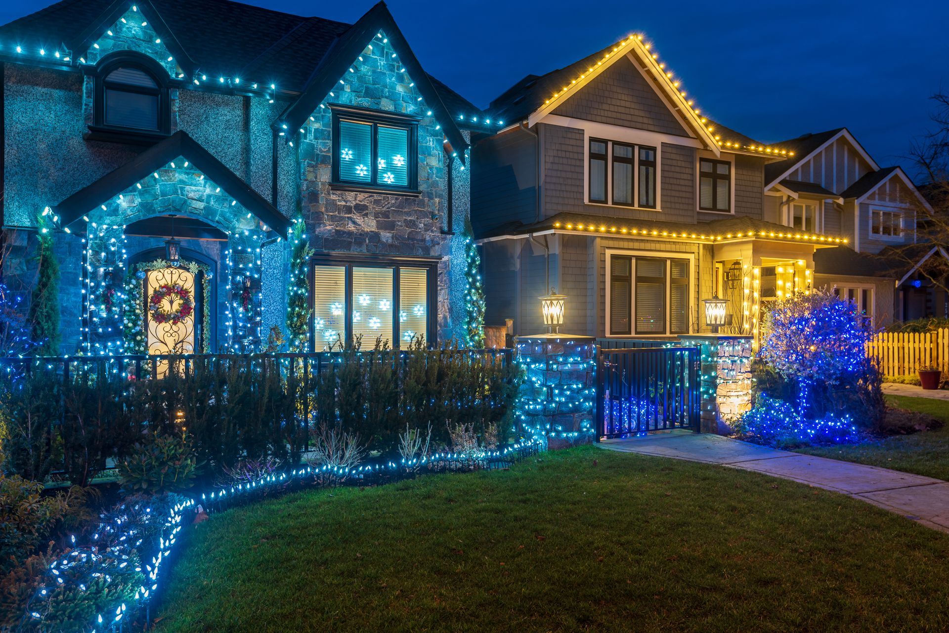 Permanent home lighting in blue and yellow colors on two homes. 