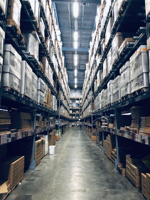 A warehouse filled with lots of boxes and shelves