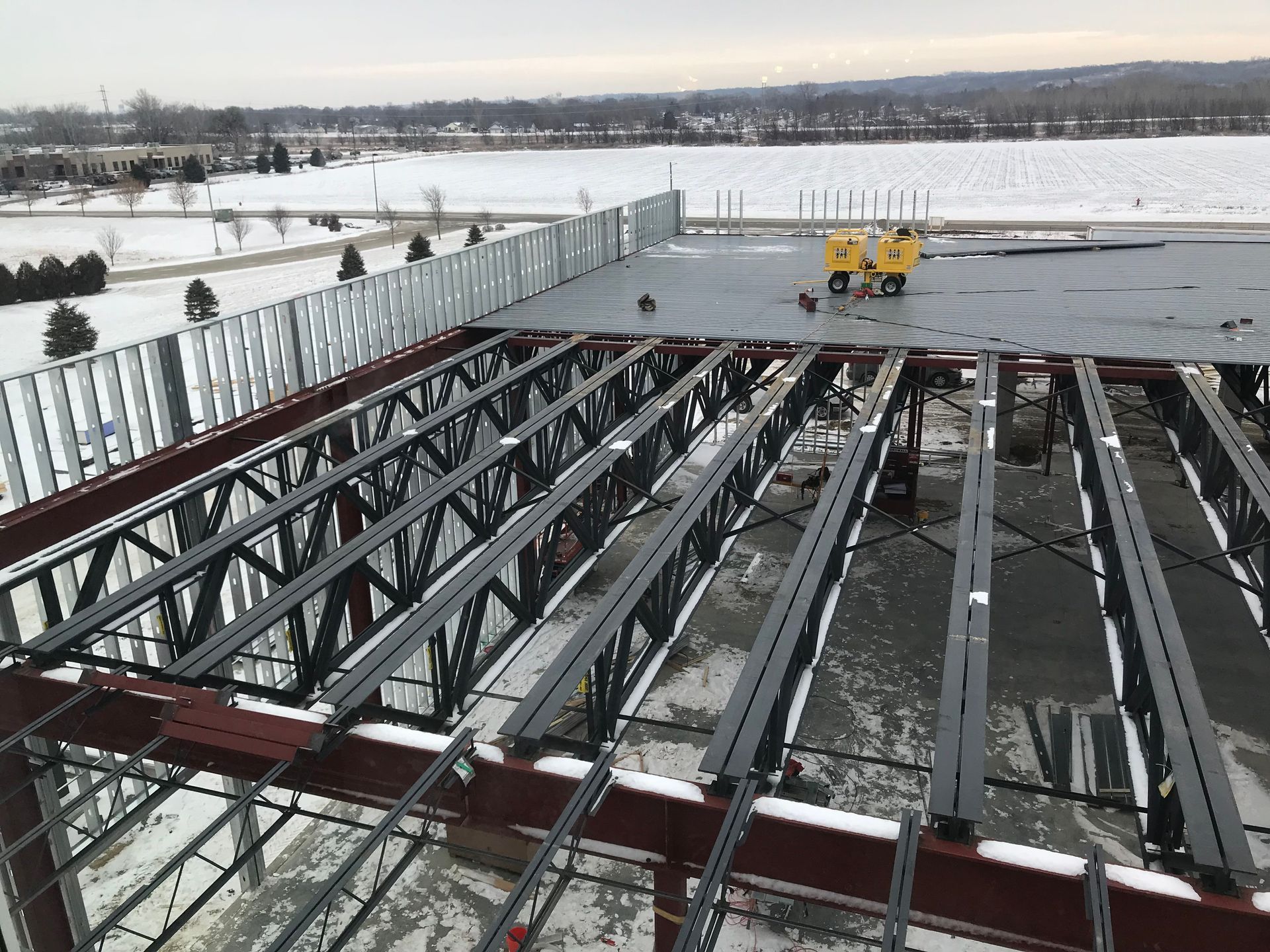 Steel beams and decking on a building roof, construction site.
