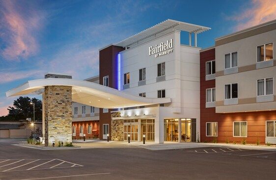 Fairfield Inn by Marriott hotel exterior at dusk with a covered entrance.