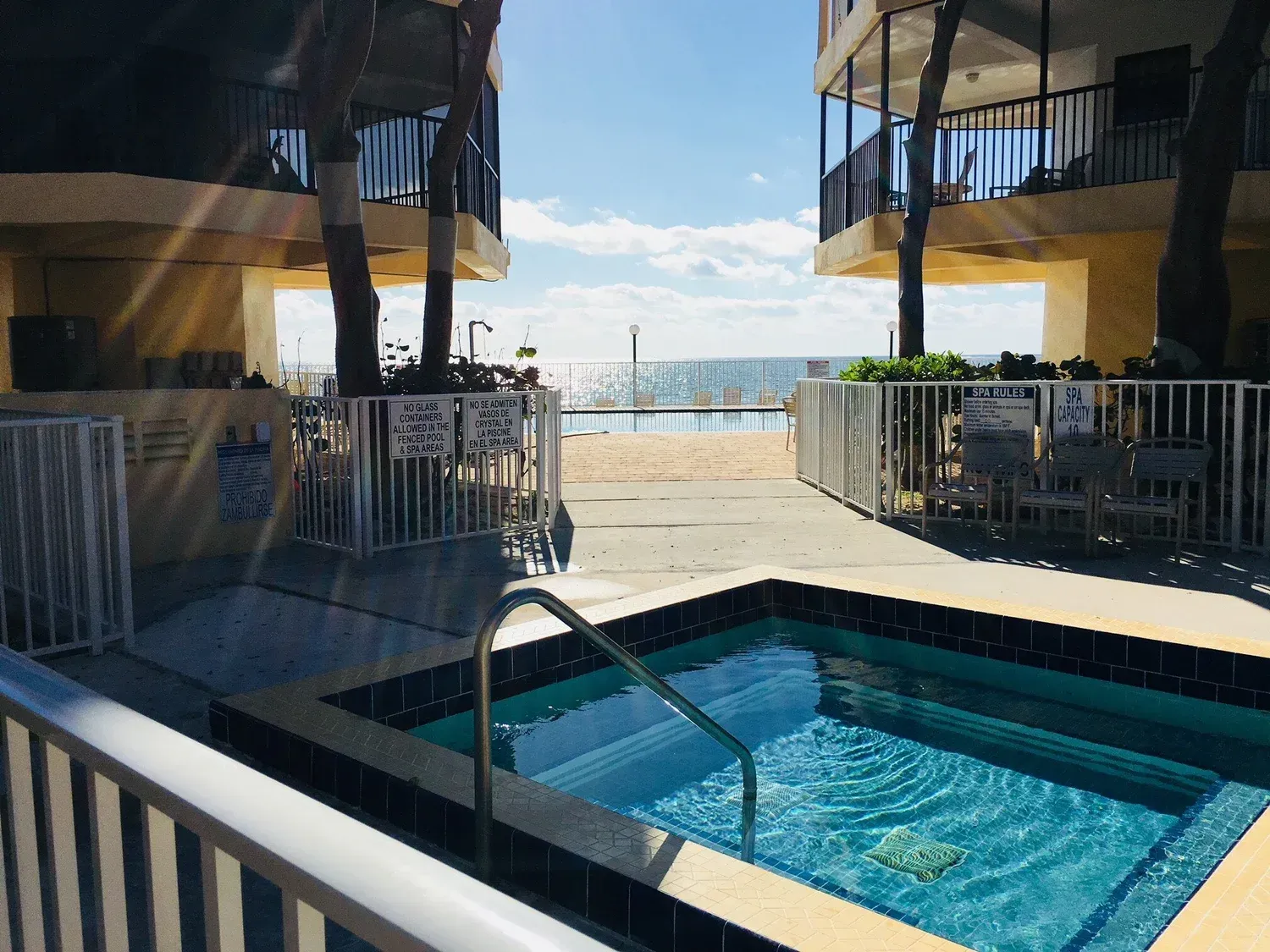 view of short distance from jacuzzi hot tub spa to pool at Coco Plum Beach and Tennis Club and Marina in the Florida Keys
