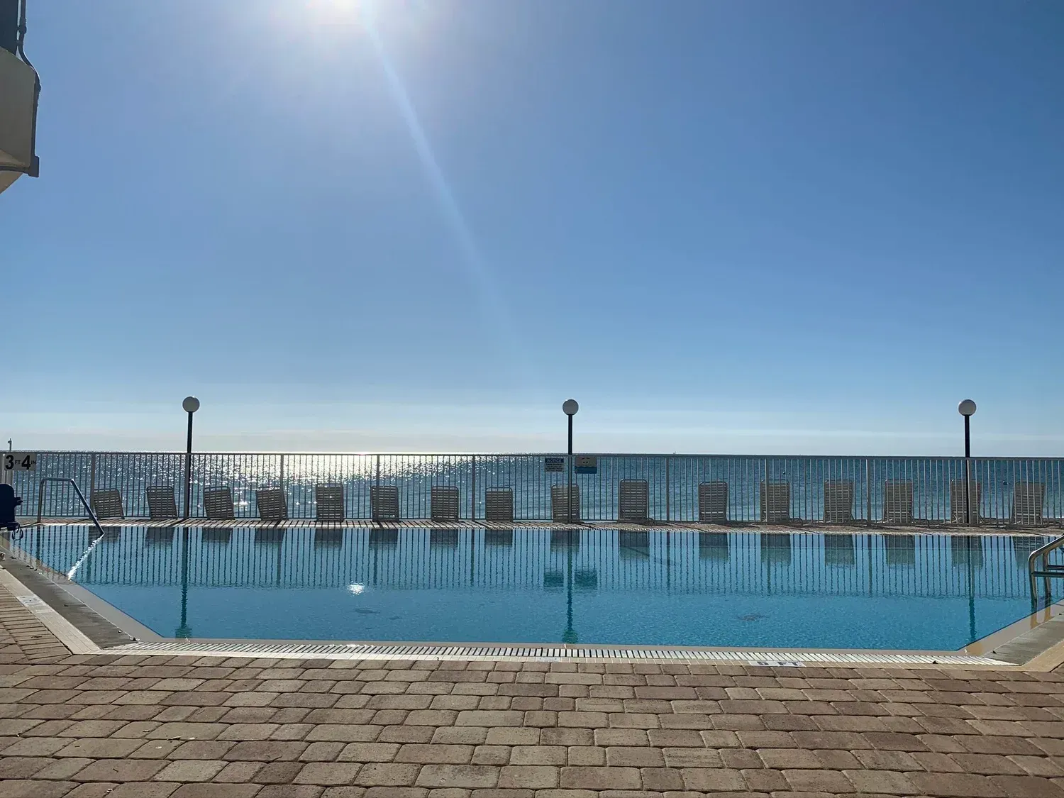 view of pool overlooking ocean at Coco Plum Beach and Tennis Club and Marina in the Florida Keys