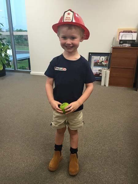 young boy dressed as fireman