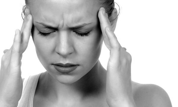 woman suffering from migraine
