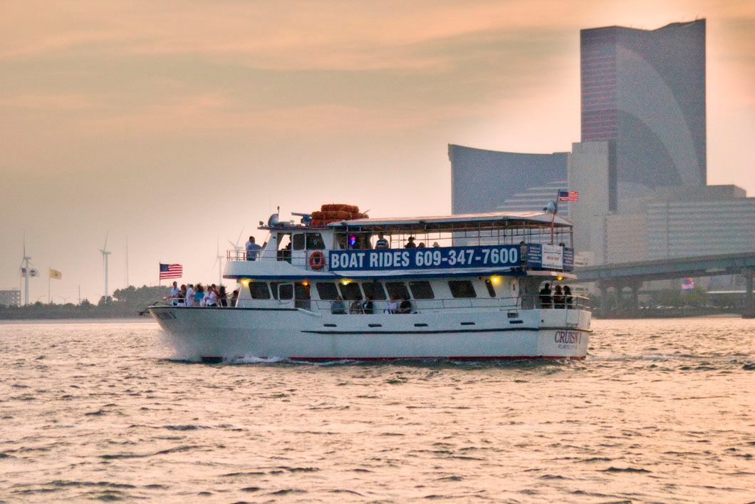 Boat on water with building in the background. 