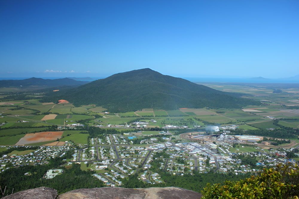Town View With a Large, Green Mountain — Greenaway Green Waste Removal in Tully, QLD