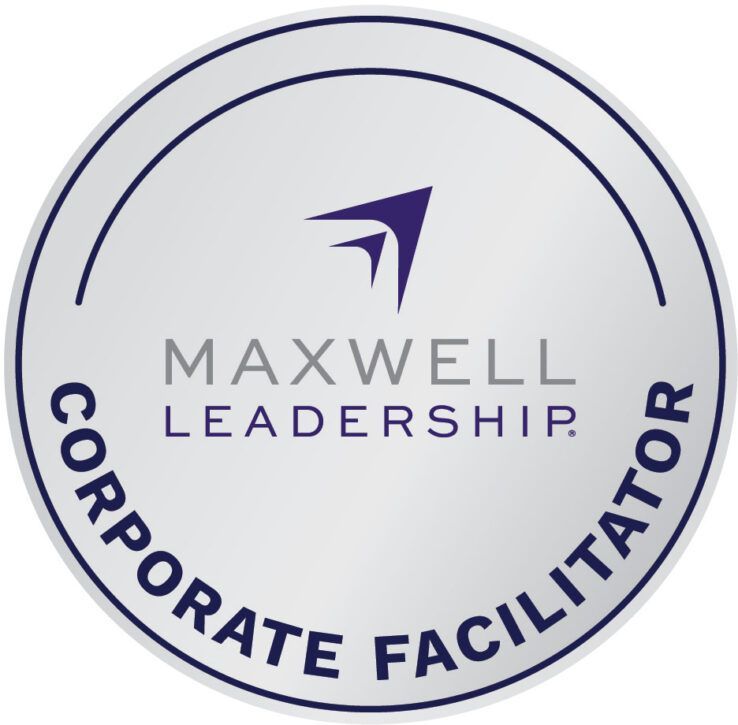 Maxwell Leadership Corporate Facilitator badge. Silver, circular, with blue text and logo.