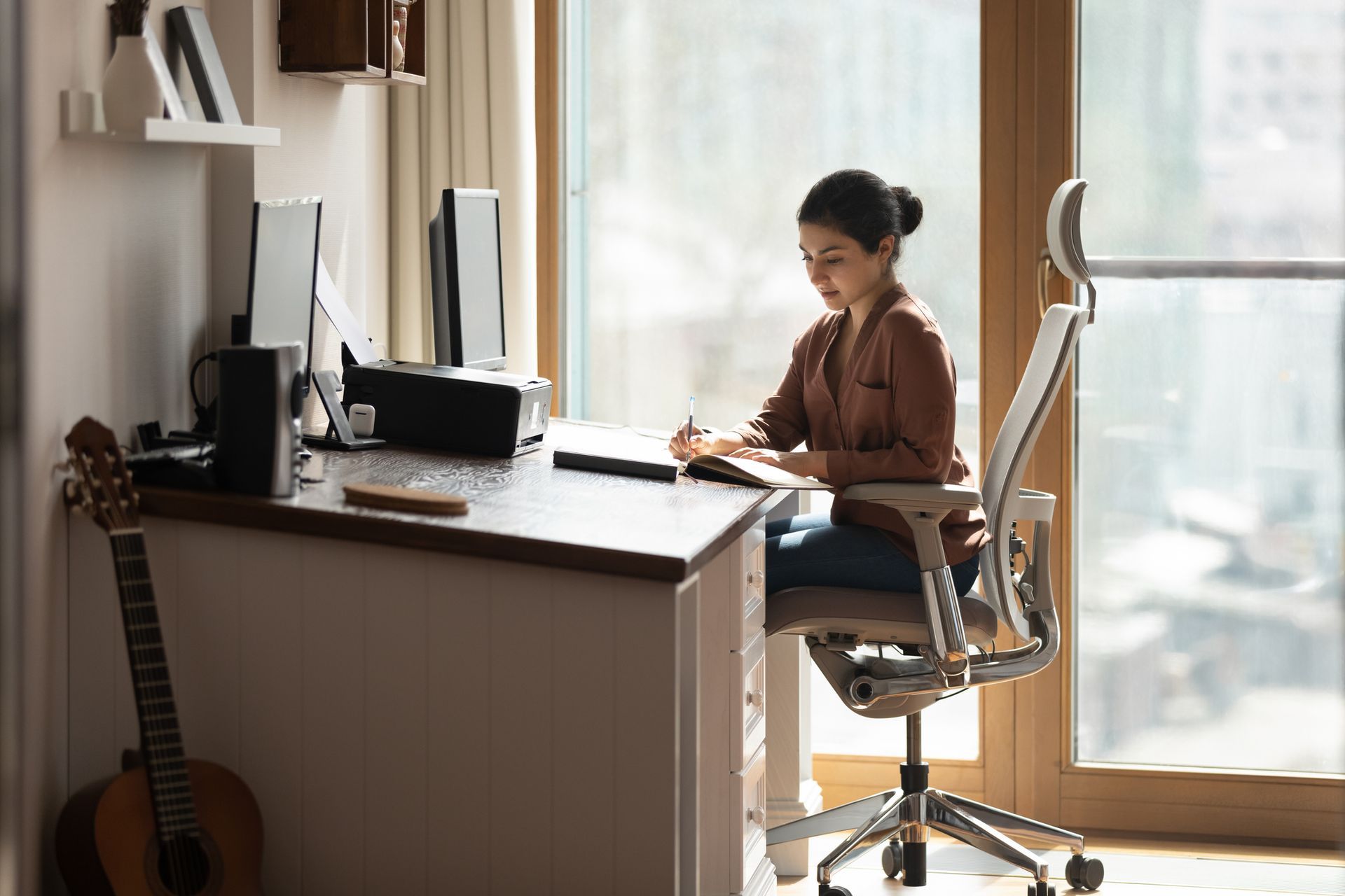 Woman Sitting in an Office Chair at the Desk — Gold Coast, QLD — Furniture N More