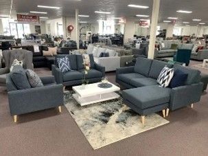 A spacious room filled with various furniture pieces at Furniture 'N' More.