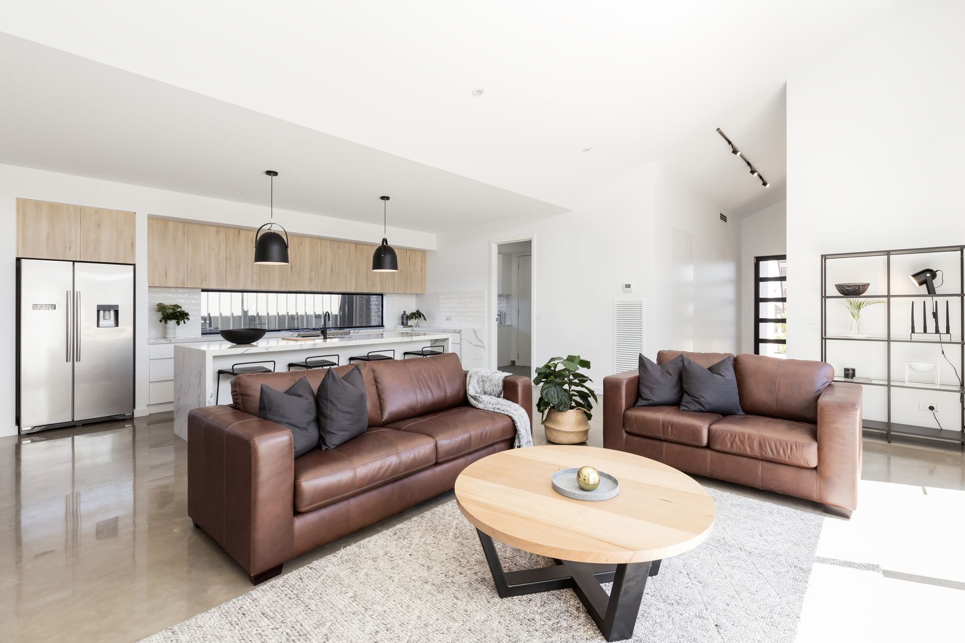 Modern living room featuring stylish lounge furniture in a cosy, well-lit space