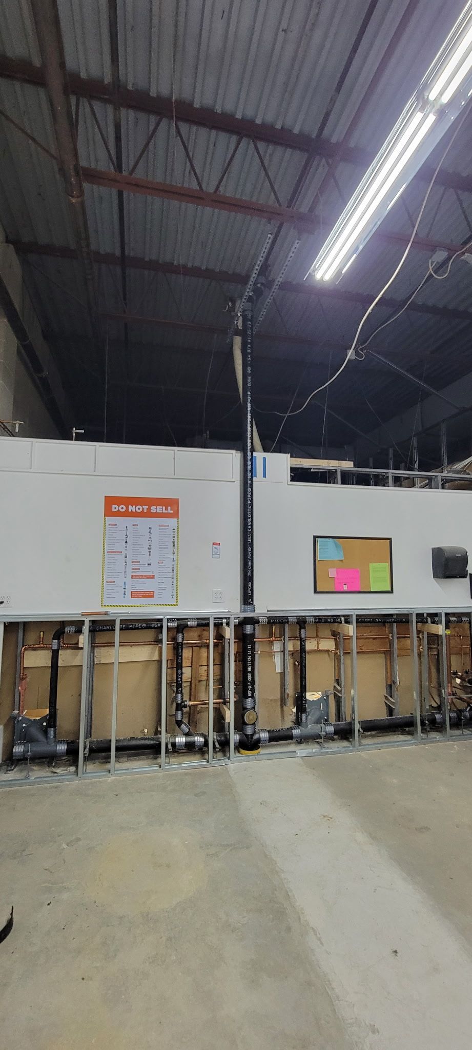 A large warehouse filled with lots of boxes and a tv.