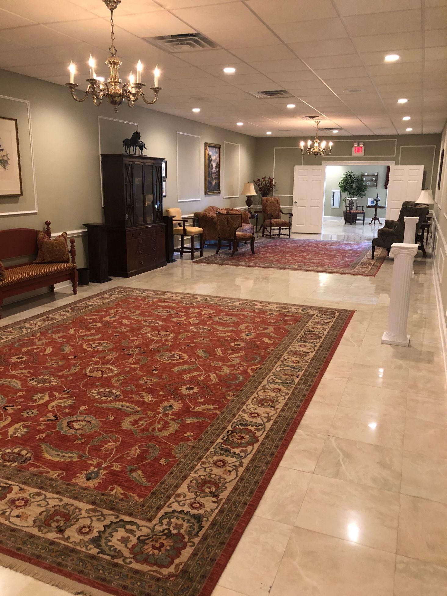 There is a large rug in the middle of the room.