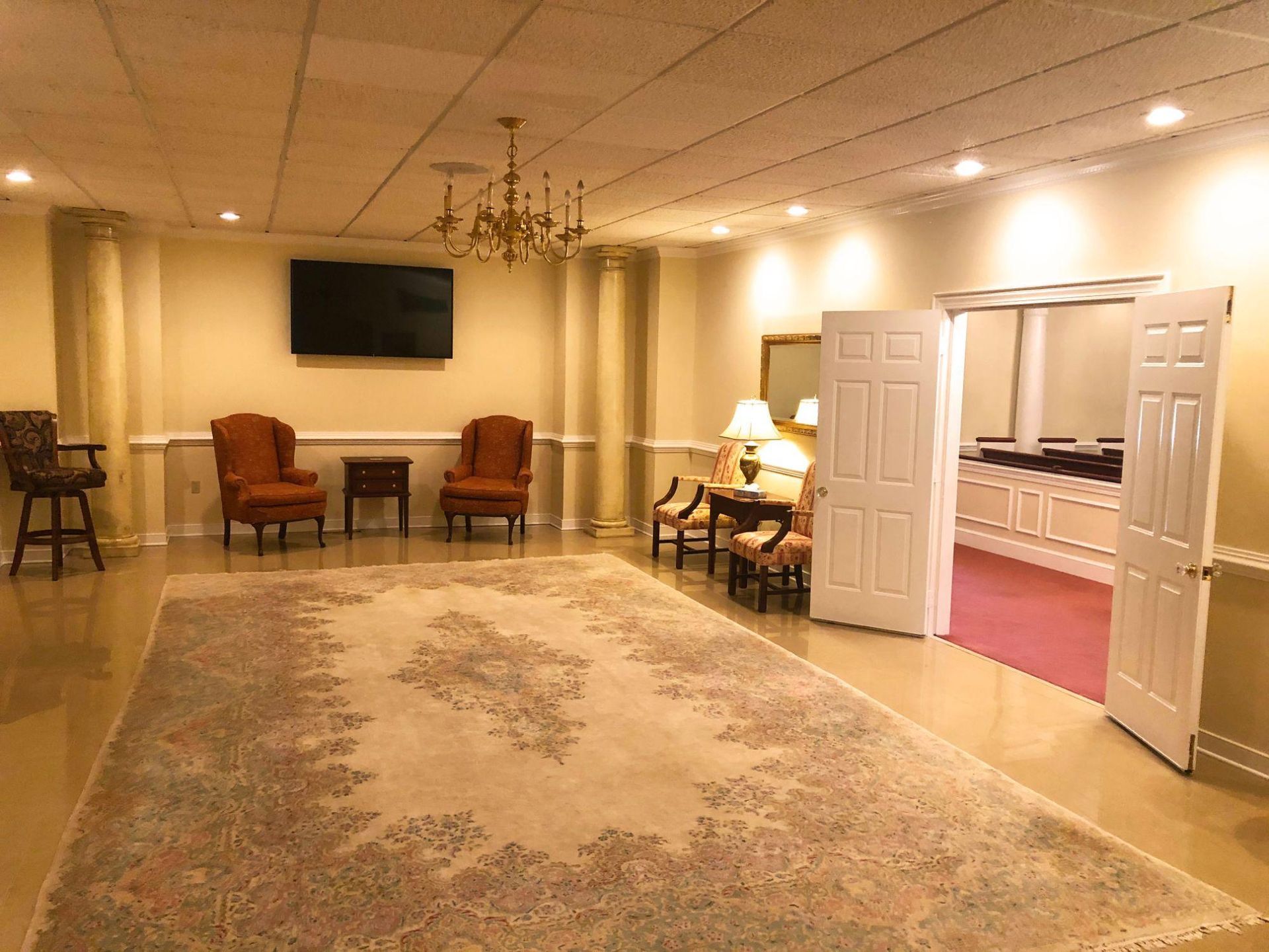 There is a large rug in the middle of the room.