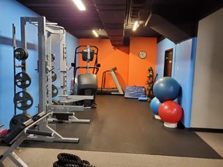 Two Fit Women Running on Treadmills - Fitness Center in Grain Valley, MO