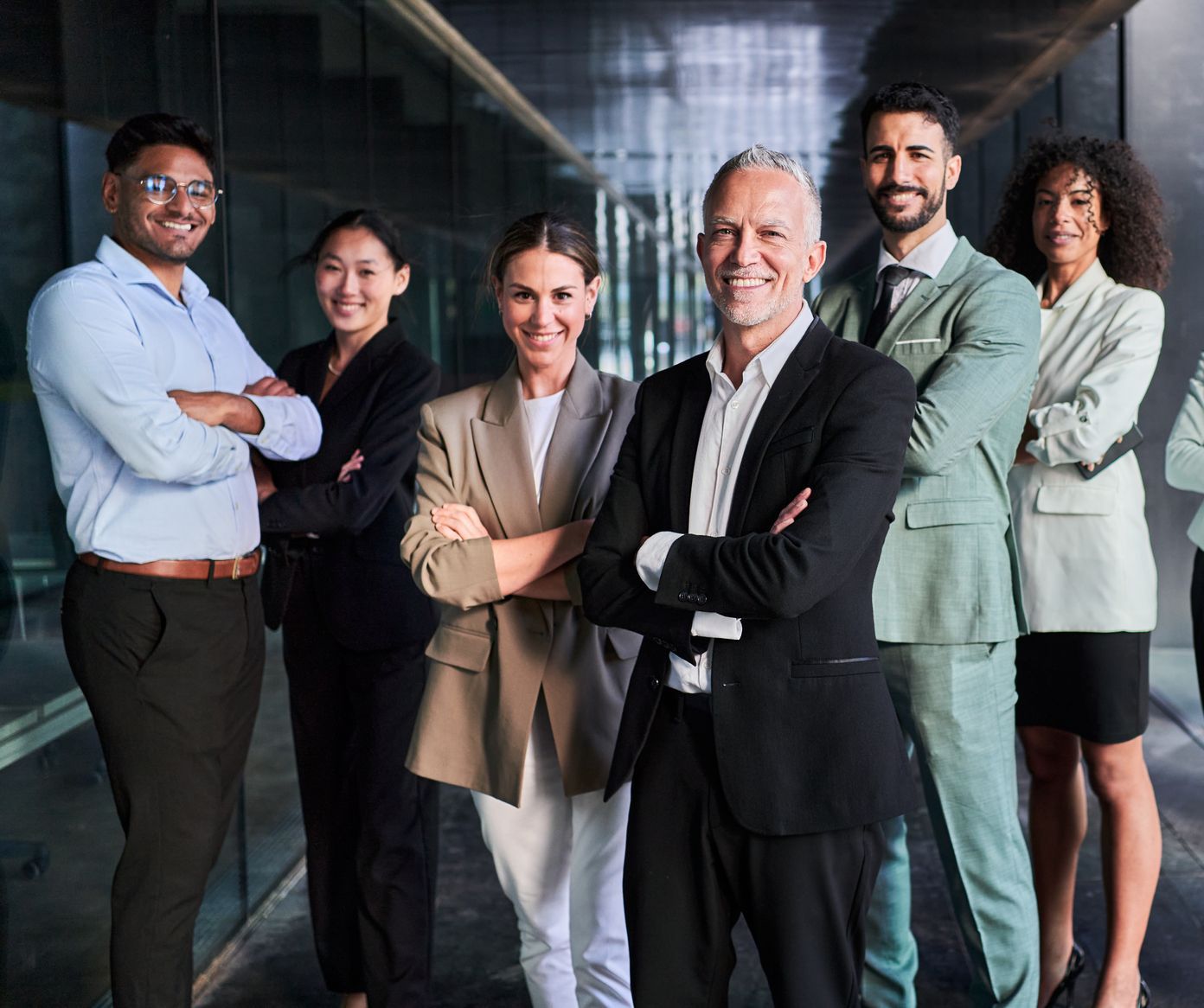 A group of business people are posing for a picture together.