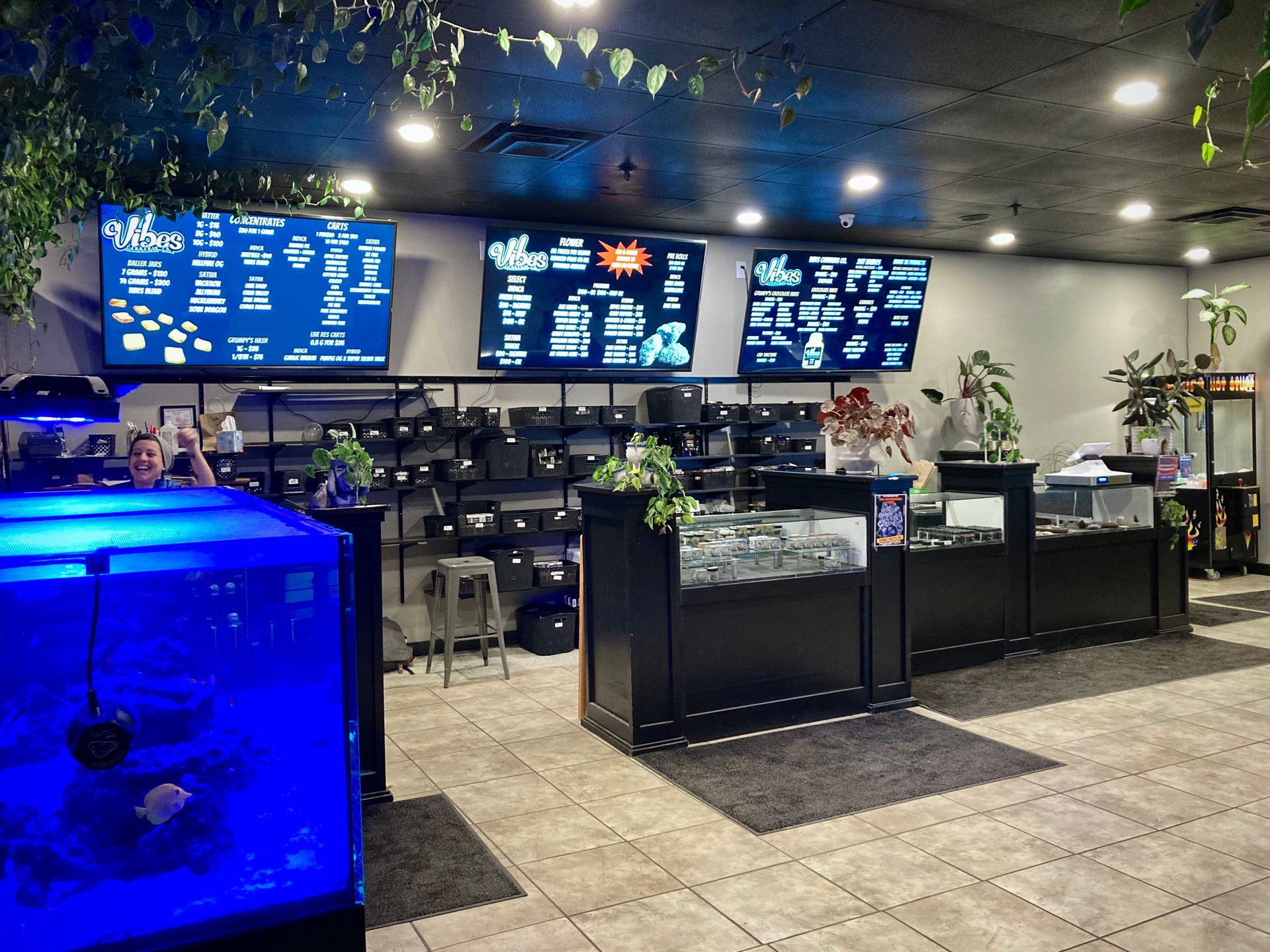 A fish tank is sitting in the middle of a store.