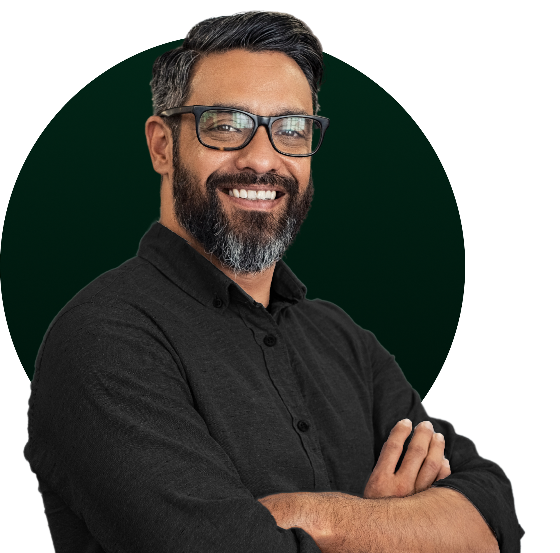 Smiling man with glasses, arms crossed, against a dark green circle background.